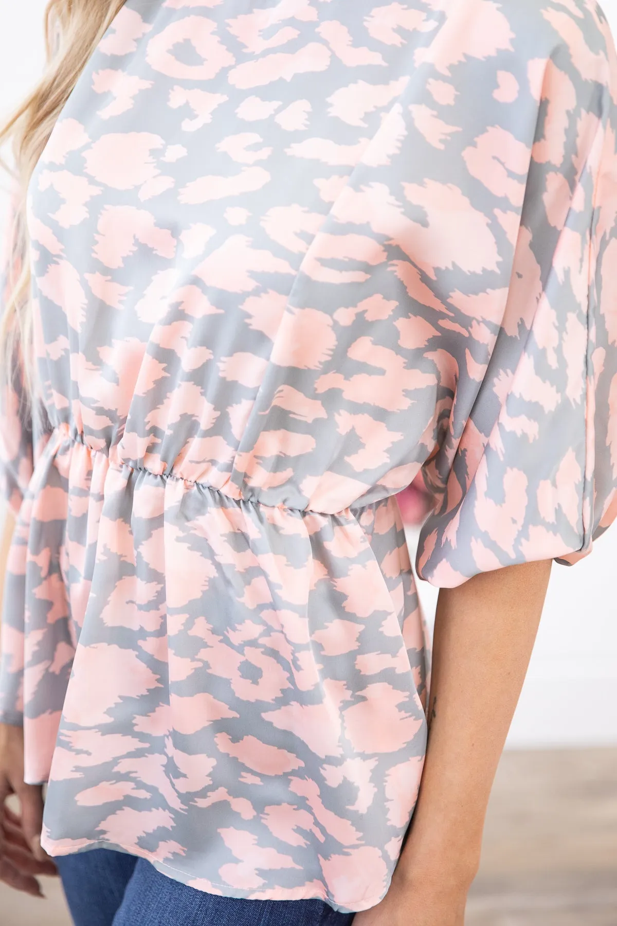 Blush Animal Print Dolman Sleeve Peplum Top